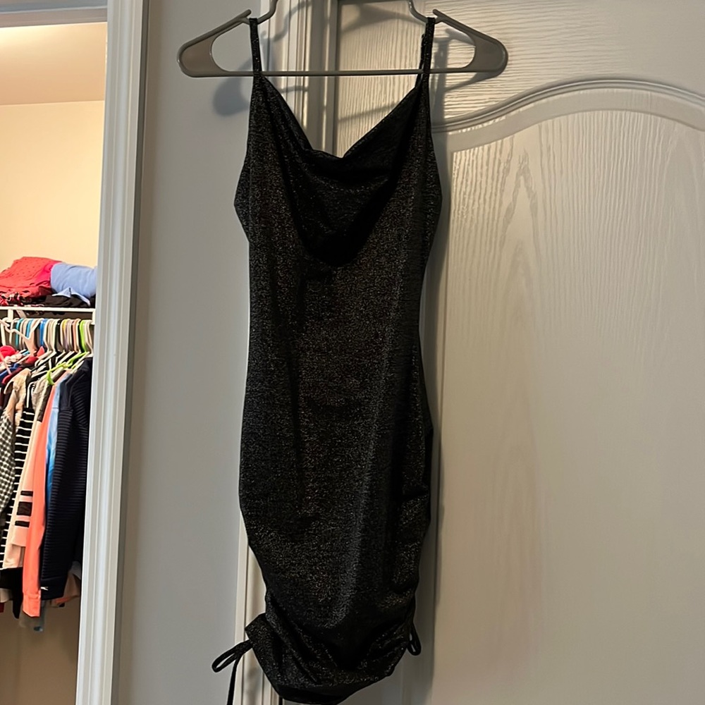 Black with sparkle mini dress. Tight fitting.